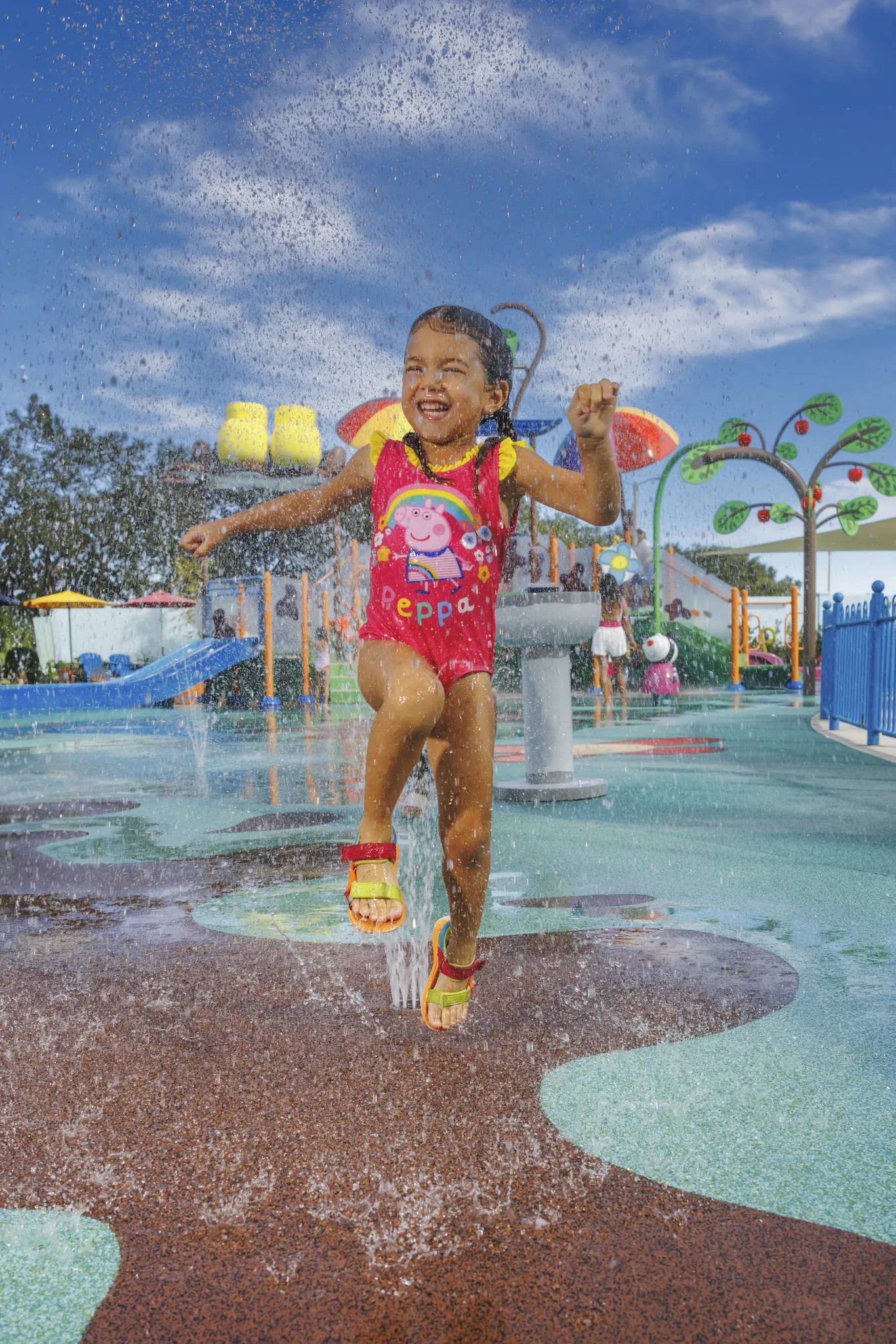 Girl in swim suit at the splash pad