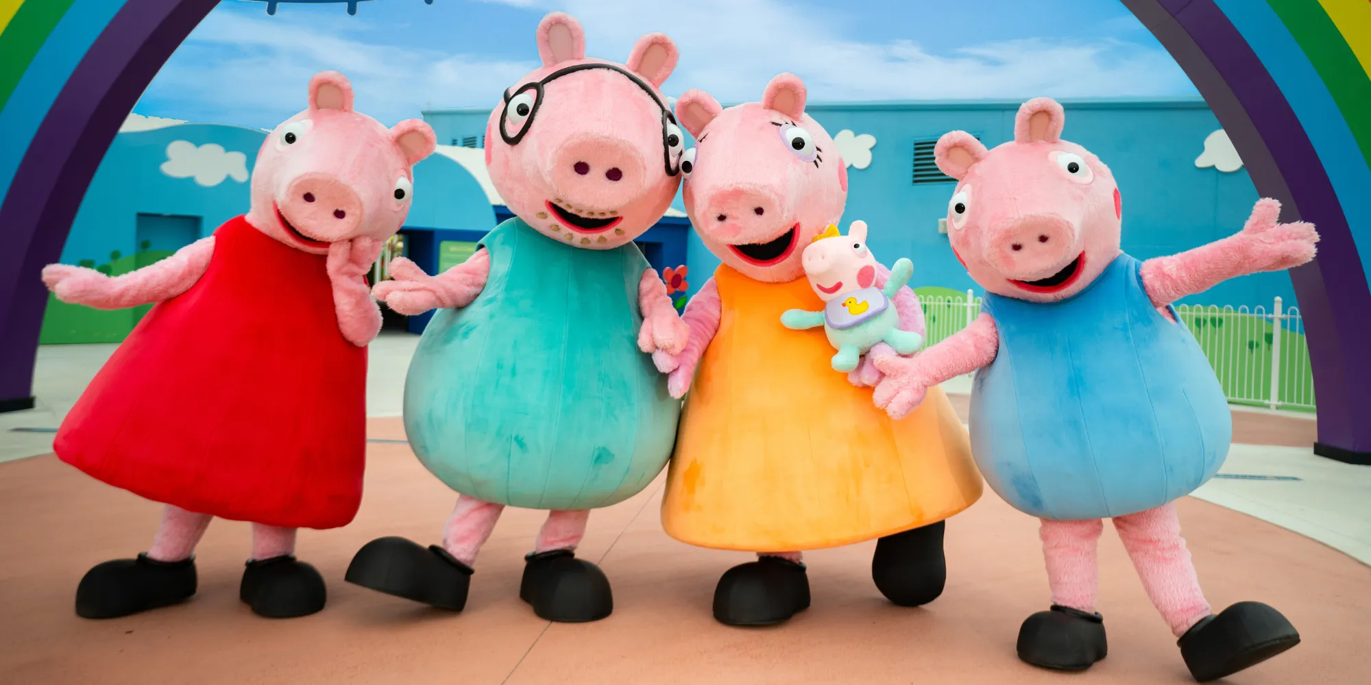 A photo of in park characters: Peppa Pig, Daddy Pig, Mommy Pig, Baby Evie Pig, and George Pig.