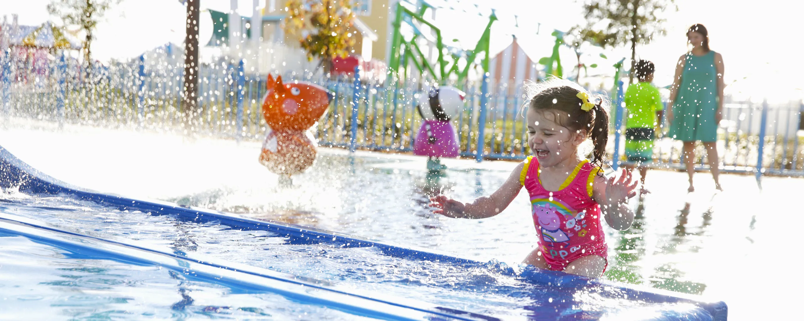 Little girl playing at Muddy Puddles Splash Pad