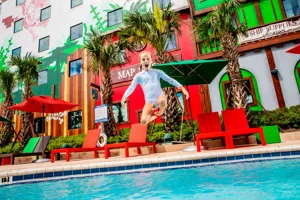 Pirate Island Hotel Girl Jumping In Pool